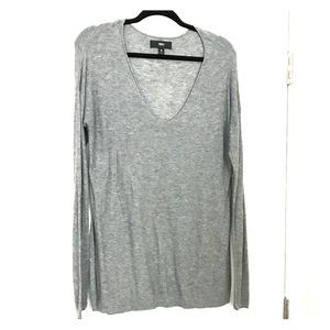 Light grey long sleeve sweater.